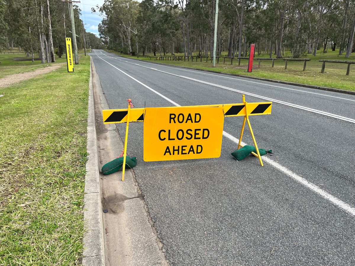 Road closed ahead sign