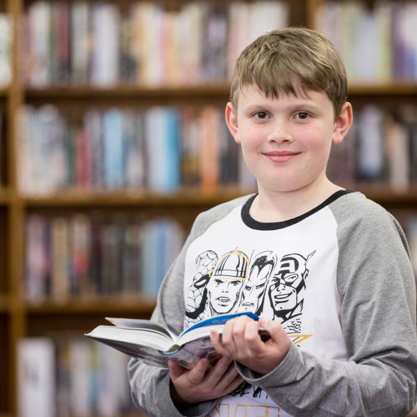 A young boy reading a book