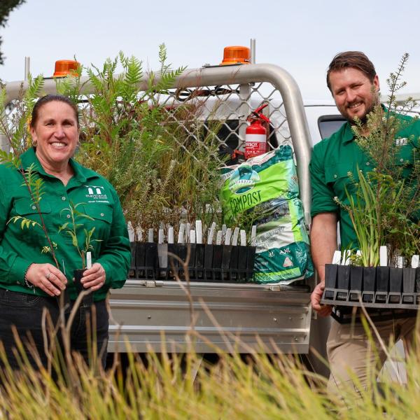 Maitland City Council staff Fiona and Will with hundreds of native seedlings