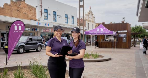 Two women in The Levee collecting public feedback