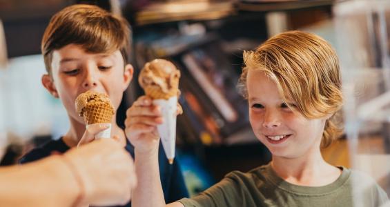 Two children buying icecream