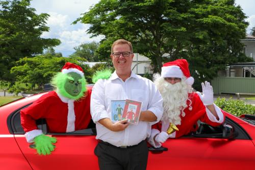 Mayor Philip Penfold with the Grinch and Santa