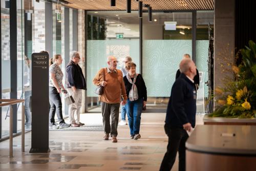 Couple walking into the entrance of Maitland Administration Centre