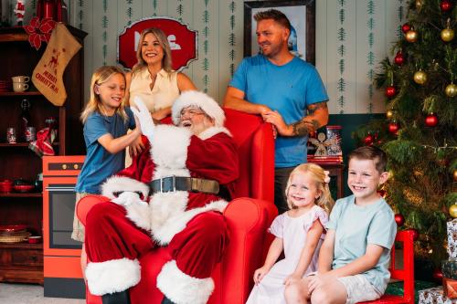 Family sitting with Santa for photo