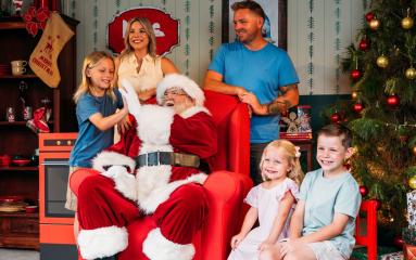 Family sitting with Santa for photo