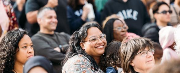 Crowd shot with mother holding child