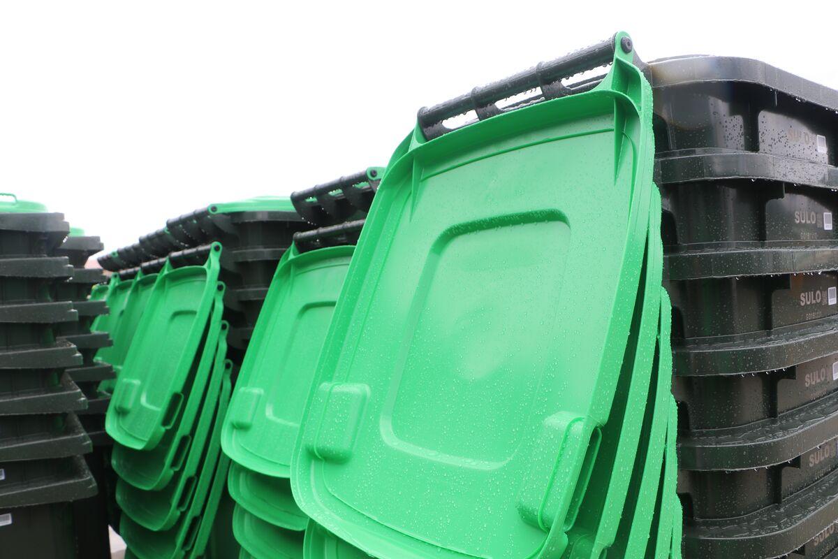 Green garden organics bins stacked together