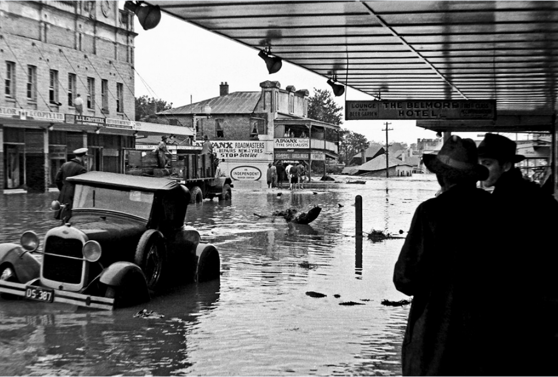 The Belmore Hotel, looking down High Street and the road flooded