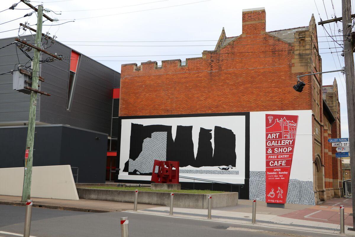 Entrance to Art Gallery, side view of exterior with art and public installation