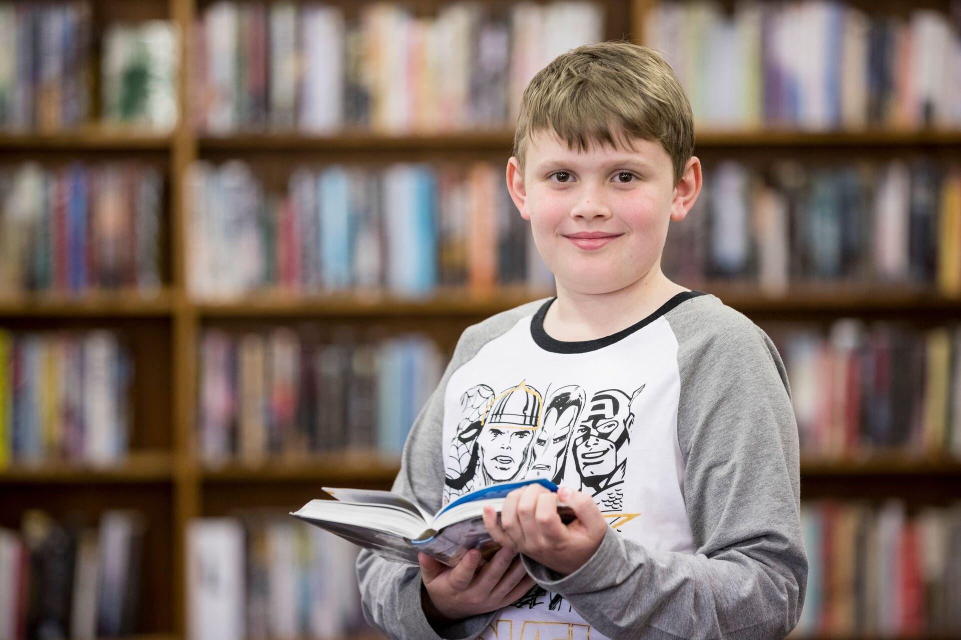 A young boy reading a book